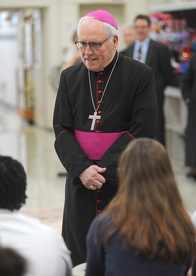 Bishop Richard Malone is all smiles on the first day of school as he meets with St. Joseph University School students on Main Street, Buffalo. (Dan Cappellazzo/Staff Photographer)